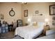 Bedroom featuring a bed with nightstands, lamps, and calming neutral decor at 3721 N Brindley Ave, Litchfield Park, AZ 85340