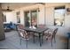 Inviting covered patio with comfortable seating, perfect for outdoor dining and relaxation at 3721 N Brindley Ave, Litchfield Park, AZ 85340