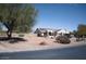 Single-story house with desert landscaping and solar panels on a clear day at 3721 N Brindley Ave, Litchfield Park, AZ 85340
