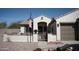Inviting single-story home featuring a quaint gated courtyard and drought-tolerant landscaping at 3721 N Brindley Ave, Litchfield Park, AZ 85340
