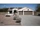 Charming single-story home featuring a well-manicured desert landscape and two-car garage at 3721 N Brindley Ave, Litchfield Park, AZ 85340