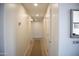 Bright hallway with recessed lighting, neutral walls, and contrasting carpet flooring at 3721 N Brindley Ave, Litchfield Park, AZ 85340