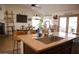 Modern kitchen island with sink, breakfast bar and stone countertops at 3721 N Brindley Ave, Litchfield Park, AZ 85340