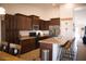 Updated kitchen with stainless steel appliances, breakfast bar, and ample cabinet storage at 3721 N Brindley Ave, Litchfield Park, AZ 85340