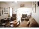 Cozy living room featuring comfortable seating, a ceiling fan, and warm, inviting decor at 3721 N Brindley Ave, Litchfield Park, AZ 85340
