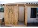 This backyard features a wooden outdoor shower with desert landscaping at 3721 N Brindley Ave, Litchfield Park, AZ 85340