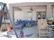Relaxing covered patio with comfortable seating and a ceiling fan at 3721 N Brindley Ave, Litchfield Park, AZ 85340