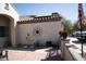 Cozy patio with decorative compass, drought-tolerant plants and a charming, rustic aesthetic at 3721 N Brindley Ave, Litchfield Park, AZ 85340