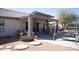 Enjoy the outdoors in this covered patio with a swing and seating area at 3721 N Brindley Ave, Litchfield Park, AZ 85340