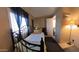Bedroom with a metal frame bed, dark curtains, and a view to a bathroom at 4065 E University Dr # 471, Mesa, AZ 85205