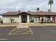 Community center exterior featuring a covered gazebo and ample parking spaces at 4065 E University Dr # 471, Mesa, AZ 85205