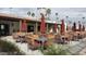 Stylish outdoor dining area with umbrella-covered tables, perfect for enjoying the community's ambiance at 4065 E University Dr # 471, Mesa, AZ 85205