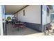 Covered patio with a table and four chairs with comfortable cushions, perfect for outdoor relaxing at 4065 E University Dr # 471, Mesa, AZ 85205