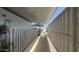 A walkway with a white fence, connecting different parts of the property at 4065 E University Dr # 471, Mesa, AZ 85205