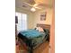 Comfortable bedroom featuring a wooden bed frame and a ceiling fan at 4134 E Bellerive Dr, Chandler, AZ 85249