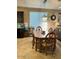 Cozy dining room with a wooden table set for six and modern lighting fixture at 4134 E Bellerive Dr, Chandler, AZ 85249