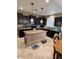 Modern kitchen featuring dark cabinetry, granite countertops, and a central island with pendant lighting at 4134 E Bellerive Dr, Chandler, AZ 85249