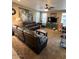 Spacious living room featuring a ceiling fan and a comfortable leather sofa set at 4134 E Bellerive Dr, Chandler, AZ 85249