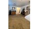 Inviting living room features carpet, a bar and an entry door leading to the home's interior at 4134 E Bellerive Dr, Chandler, AZ 85249