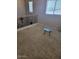 Loft featuring carpet, three windows, a glass table, and a wrought iron railing at 4134 E Bellerive Dr, Chandler, AZ 85249