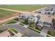 Aerial view of homes featuring well-kept lawns, solar panels, and neighborhood streets at 4381 E Rawhide St, Gilbert, AZ 85296