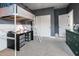 Bedroom features a loft bed with desk, carpeted floor, and a closet with sliding doors at 4381 E Rawhide St, Gilbert, AZ 85296