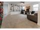 Spacious bonus room featuring built-in shelving, a climbing wall, and ample natural light at 4381 E Rawhide St, Gilbert, AZ 85296