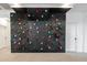 View of the climbing wall located in the bonus room at 4381 E Rawhide St, Gilbert, AZ 85296