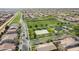 Aerial shot of a community park surrounded by houses, featuring a playground and green space at 4381 E Rawhide St, Gilbert, AZ 85296