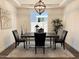 Elegant dining room showcases a modern light fixture and natural light at 4381 E Rawhide St, Gilbert, AZ 85296