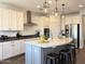 Well-lit kitchen with stainless appliances, central island and gray cabinetry at 4381 E Rawhide St, Gilbert, AZ 85296
