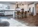 Stylish kitchen with white cabinets, stainless steel appliances, and a center island at 4381 E Rawhide St, Gilbert, AZ 85296