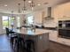 Bright eat-in kitchen showcases a gray island and stainless steel appliances at 4381 E Rawhide St, Gilbert, AZ 85296