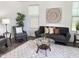 Cozy living room with stylish furniture, accent lighting, and a neutral color palette at 4381 E Rawhide St, Gilbert, AZ 85296