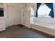 Spa-like bathroom with separate shower and soaking tub beneath bright window at 4381 E Rawhide St, Gilbert, AZ 85296