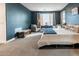Stylish main bedroom with a cozy seating area and an inviting king-size bed at 4381 E Rawhide St, Gilbert, AZ 85296