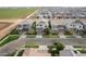 Aerial view of a neighborhood with well-spaced homes, manicured lawns, and tree-lined streets at 4381 E Rawhide St, Gilbert, AZ 85296