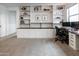 Bright office with custom built-ins, desk, and shelves for stylish storage and workspace at 4381 E Rawhide St, Gilbert, AZ 85296