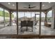 Relaxing covered patio with dining set, showcasing the backyard oasis with pool views at 4381 E Rawhide St, Gilbert, AZ 85296