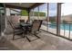 Inviting screened patio with a dining set, offering views of the sparkling pool at 4381 E Rawhide St, Gilbert, AZ 85296