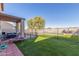 Large backyard with pool, turf and covered patio at 45608 W Barbara Ln, Maricopa, AZ 85139