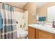 Standard bathroom featuring a shower-tub combo, vanity, and a neutral color palette at 45608 W Barbara Ln, Maricopa, AZ 85139