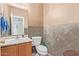 Bathroom features a single sink vanity, tiled walls, and a toilet at 45608 W Barbara Ln, Maricopa, AZ 85139