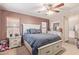 Comfortable bedroom with a ceiling fan, carpet, and a serene ambiance at 45608 W Barbara Ln, Maricopa, AZ 85139