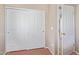 Bedroom with closet space, hardwood floors, and easy access to other rooms at 45608 W Barbara Ln, Maricopa, AZ 85139