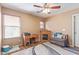 Inviting bedroom with a cozy seating area, fireplace, and natural light at 45608 W Barbara Ln, Maricopa, AZ 85139