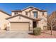 Attractive two-story home with a well-maintained front yard and an attached two-car garage at 45608 W Barbara Ln, Maricopa, AZ 85139