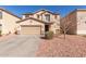 Charming home featuring a two-car garage, neutral stucco facade, and low-maintenance landscaping at 45608 W Barbara Ln, Maricopa, AZ 85139