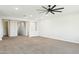 Spacious, carpeted room with neutral walls, ceiling fan, and ample natural light, perfect for relaxation at 5100 E Rancho Paloma Dr # 2061, Cave Creek, AZ 85331