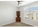 Bedroom with an antique cabinet, white walls, and natural light from the window at 5100 E Rancho Paloma Dr # 2061, Cave Creek, AZ 85331